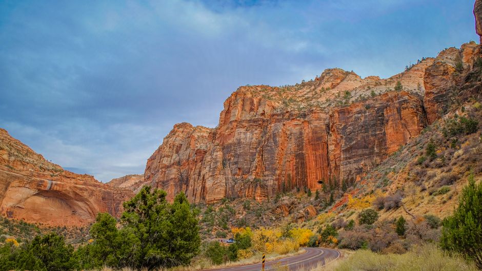 Beautiful scenic view of red cliffs and winding road in Zion National Park.