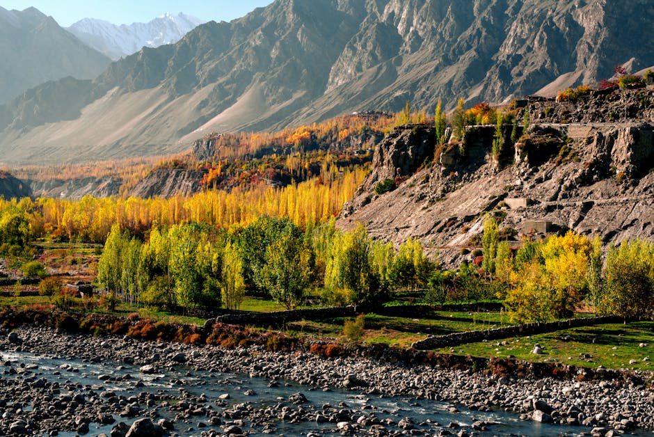 Beautiful autumn landscape of Hunza Nagar with rugged mountains and vibrant foliage.