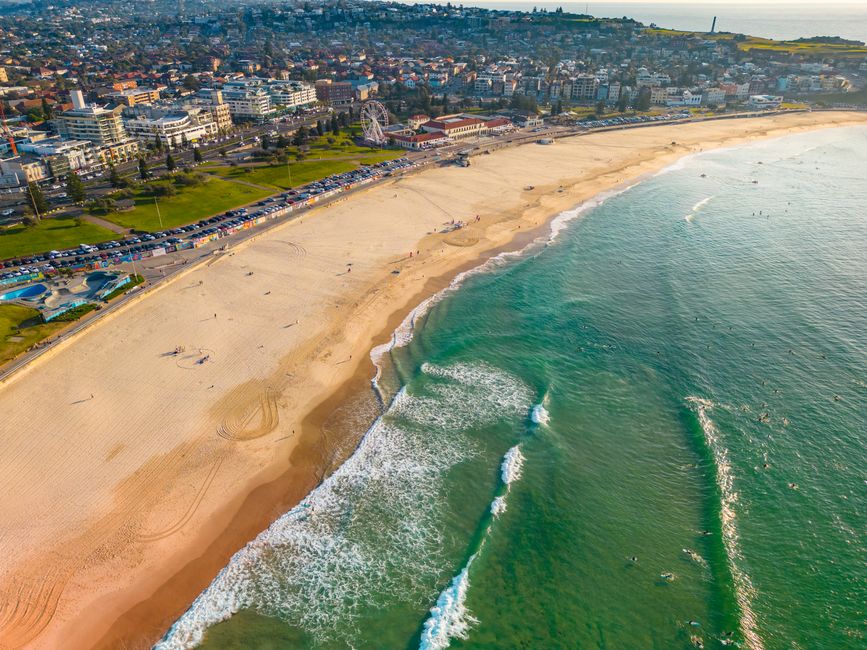 Stunning aerial view of Bondi Beach, showing the vibrant shoreline and surrounding cityscape.