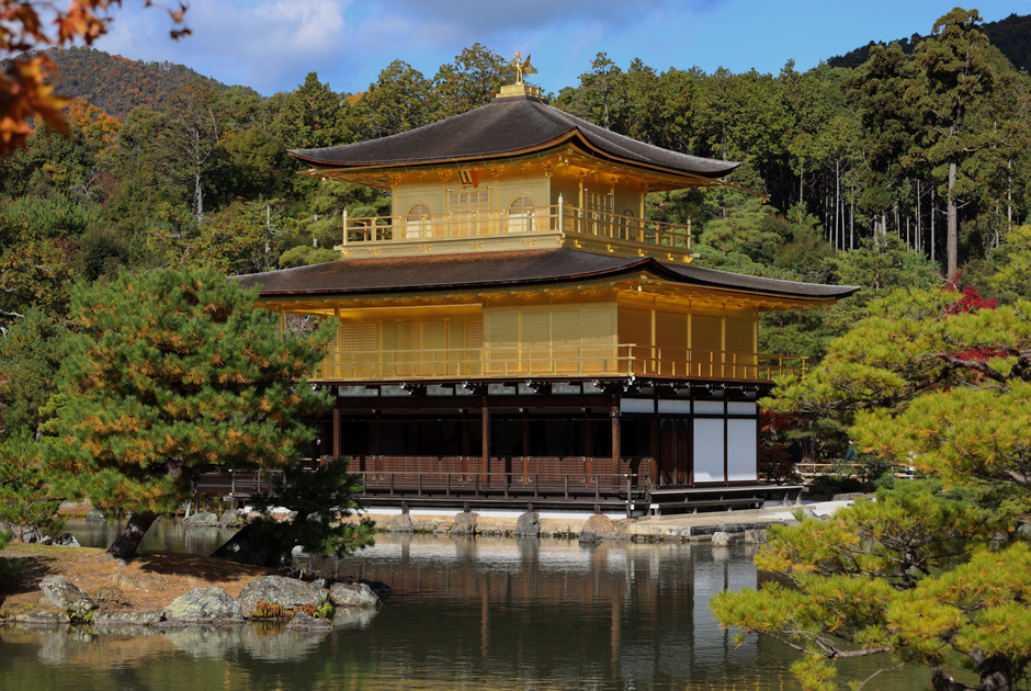 Stunning view of the Kinkaku-ji Temple surrounded by lush greenery in Kyoto, Japan.