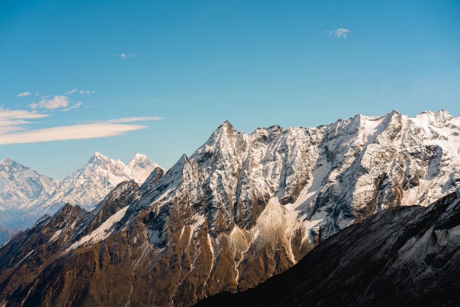 Stunning view of snow-capped Himalayan peaks against a clear blue sky in Nepal.