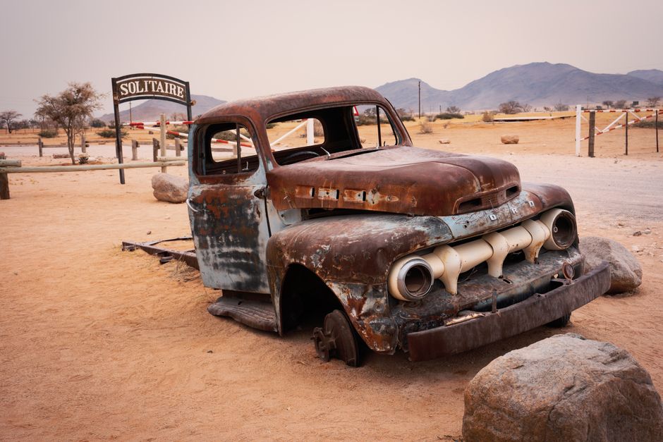 Rusty old truck in Solitaire, Namibia desert, a symbol of resilience and time passage.