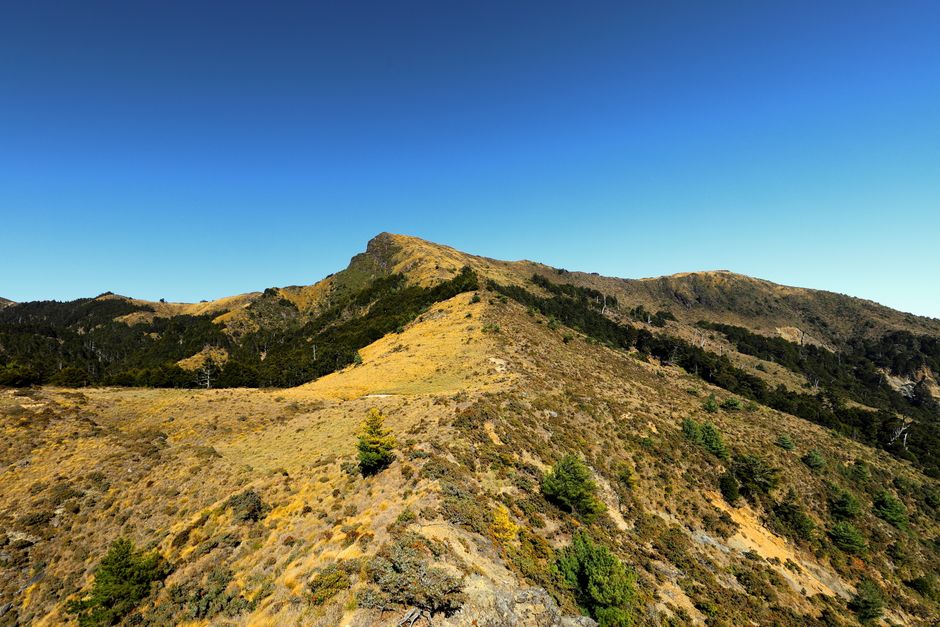 Beautiful clear sky over the rugged mountain range in Taoyuan District, Kaohsiung City, Taiwan.