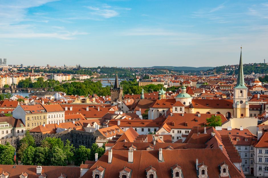 Stunning aerial view of Prague's historic center showcasing iconic architecture and vibrant rooftops.