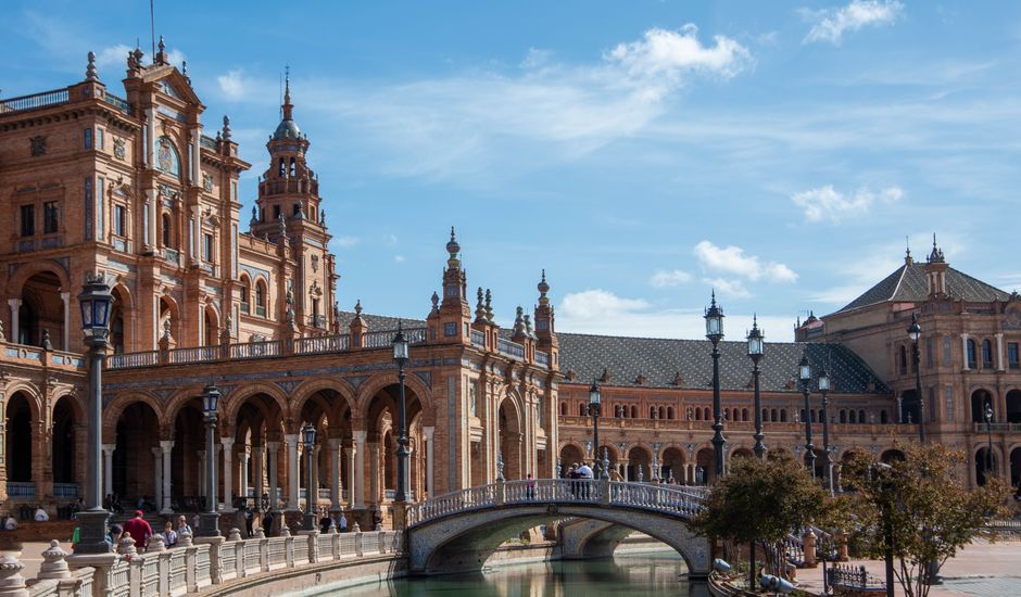 Beautiful view of the Plaza de España in Seville with its iconic architecture and bridge.